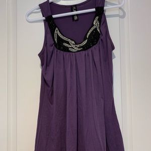 Purple sleeveless blouse with jewel detail